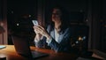 Exhausted girl working office laptop late evening finishing call close up. Royalty Free Stock Photo