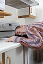 Exhausted man asleep in a frying pan Royalty Free Stock Photo