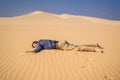 Exhausted man in the desert. Apathy, fatigue, exhaustion, mental disorders concept. Mental health Royalty Free Stock Photo