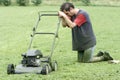 Exhausted Man with Lawn Mower