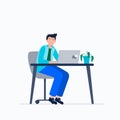 Exhausted man sitting at his workplace with a computer in the office. Emotional burnout concept. Long working day in the Royalty Free Stock Photo