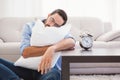 Exhausted man sleeping with head resting on pillow Royalty Free Stock Photo