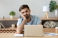 Exhausted man fall asleep near laptop at home workplace Royalty Free Stock Photo