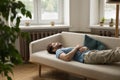 Exhausted peaceful sleepy young woman lying on back on couch