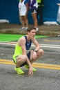 Exhausted Runner Kneels To Catch Breath At Peachtree Road Race