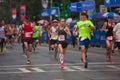 Exhausted Runners Cross Finish Line At Atlanta Peachtree Road Race