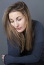 Exhausted 20s girl leaning her face on her hand to nap Royalty Free Stock Photo