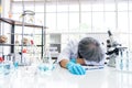 Exhausted scientist sleeping in laboratory. People lifestyles and occupation concept. Science and experiment in lab theme