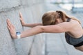 Exhausted sportswoman with smart watch