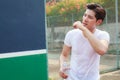 Exhausted sweaty athletic man holding clean bottle of fresh mineral drinking water outdoor under summer heat. Health care, Well Royalty Free Stock Photo