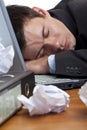 Exhausted, tired businessman sleeping at desk