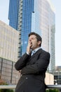 Exhausted tired businessman yawning in need of sleep after long hours of work Royalty Free Stock Photo