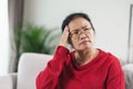 Exhausted tired depressed stressed thoughtful mature senior woman suffering from headaches, Brain diseases, mental problems, Royalty Free Stock Photo