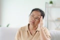 Exhausted tired depressed stressed thoughtful mature senior woman suffering from headaches, Brain diseases, mental problems, Royalty Free Stock Photo