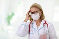 Exhausted tired doctor or nurse. Virus outbreak Royalty Free Stock Photo