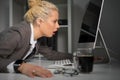 Exhausted and tired woman looking at computer screen very close Royalty Free Stock Photo