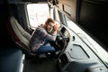 Exhausted truck driver falling asleep on steering wheel. Tiredness and sleeping concept. Royalty Free Stock Photo