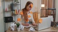 Exhausted woman freelancer with pasted stickers using laptop having concentration problem in office Royalty Free Stock Photo