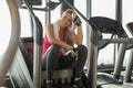 Exhausted woman at the gym wiping off sweat Royalty Free Stock Photo