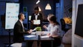 Exhausted workaholic african american showing financial graphs using tablet overworking in company office Royalty Free Stock Photo