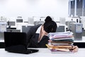 Exhausted worker napping over documents Royalty Free Stock Photo