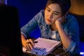 Exhausted young Asian creative feeling sleepy, looking on pc. Stratagem. Royalty Free Stock Photo