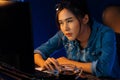 Exhausted young Asian creative feeling sleepy, looking on pc. Stratagem. Royalty Free Stock Photo