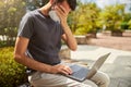 Exhausted young man sitting on the bench