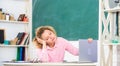 Exhausting lesson. Teacher exhausted after hard working day. School pedagogue stressful occupation. Tired student lean Royalty Free Stock Photo