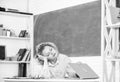 Exhausting lesson. Tired tutor fall asleep at workplace. Woman tired in school classroom. Teacher exhausted after hard Royalty Free Stock Photo