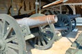 An exhibition of ancient cannons in the territory of the royal palace on a sunny day