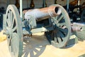 An exhibition of ancient cannons in the territory of the royal palace on a sunny day