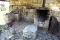 The exhibition of blacksmith craft work examples on the wall in Local Ethnological Museum . Old rusty blacksmith tools