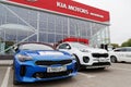 Exhibition car stands in front of the building of KIA MOTORS car selling and service center