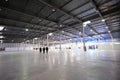 Exhibition hall of Kiev Expo center, blurred stands and people walking on a background. Kiev, Ukraine Royalty Free Stock Photo