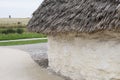 Exhibition neolithic house at Stonehenge, Salisbury, Wiltshire, England with hazel thatched roof and straw hay daubed walls