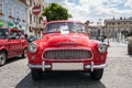 Exhibition of old cars. Old design in cars. Beautiful red old antique Skoda Octavia Super, front view. Royalty Free Stock Photo