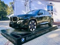 Exhibition and sale of new BMW XM G09 black car at the stand near the Dzintari Concert Hall in Majori Royalty Free Stock Photo