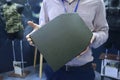 Exhibitor hands holding new made in Ukraine armor plate for soldiers