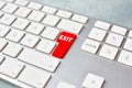 Exit concept with keyboard and red key.