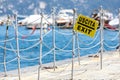 Exit into a corridor in a pier of an Italian port by the sea. No tourists due to the pandemic-induced crisis. Sign.