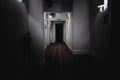 Exit fire sign on dark mysterious corridor in spooky building. Door room perspective in lonely quiet building with