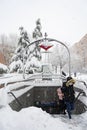 Exit from the Madrid metro in a heavy snowfall throughout the city. Several people come out of the interior.