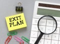 EXIT PLAN words on a small piece of paper Royalty Free Stock Photo