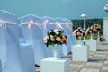 Exit registration of the newlyweds, wedding ceremony under open sky. Seating guests. Rows of chairs with white capes, close up