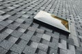 exit roof window on shingles flat polymeric roof-tiles Royalty Free Stock Photo