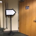 Exit sign and arrow on clinic door