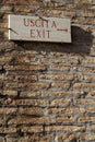 Exit sign on a brick wall Royalty Free Stock Photo