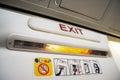 Exit sign on a commecial airplane cabin Royalty Free Stock Photo