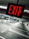 Exit sign in empty parking structure. Royalty Free Stock Photo